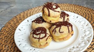 Печенье с маком, прослоенное курдом.  Завершающий штрих - тёмный шоколад.