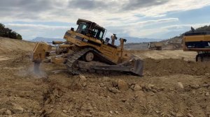 Caterpillar D8R Bulldozer Ripping & Pushing On A Road Construction Site