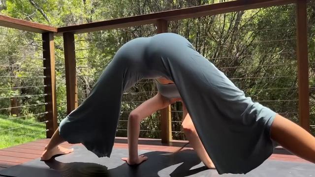 Assisted deep leg stretching and relaxation yoga -Natural Forist