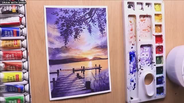 Акварельный рисунок вечернего пейзажа на берегу реки на закате
