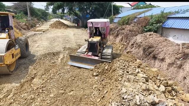 Process Build Foundation Road In Village Pouring Stone By Mini Bulldozer Pushing With Dump Trucks-00