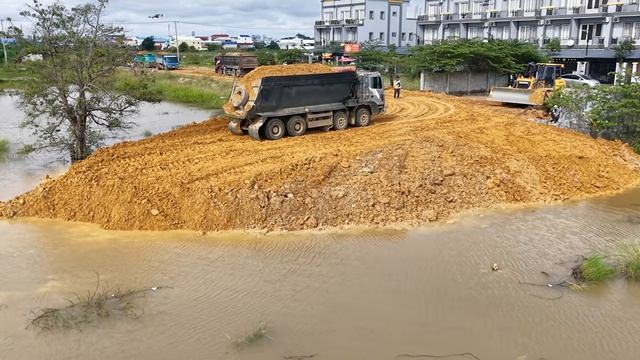 Great Job!! Work Dozer Pushing Stone Into Flooded Land With 12wheel Dump Truck Uploading-001