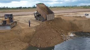 O.M.G! Incredible,The most amazing special scene with KOMATSU D58 Dozer pushing rocks into deep lake