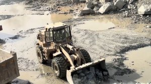 CAT 966D Loader Loading Giant Rocks into Dump TruckPowerful 966D Loader Working in Stone QuarryMassi