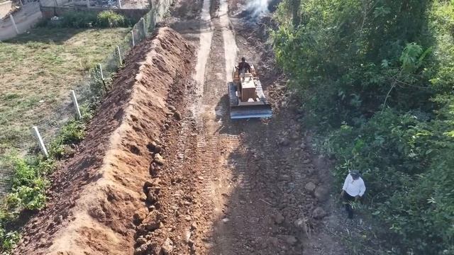 Start a new project a great landfill with a small truck carrying dust and machine Komatsu push soil смотреть онлайн