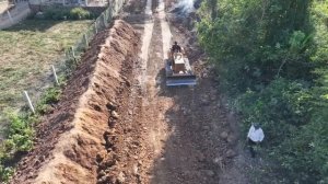 Start a new project a great landfill with a small truck carrying dust and machine Komatsu push soil