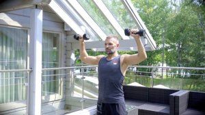 Подъёмы согнутых рук через стороны с вращением плеча