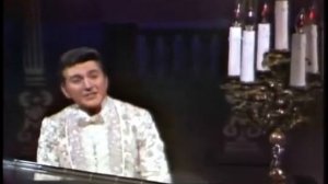 Liberace plays The impossible dream