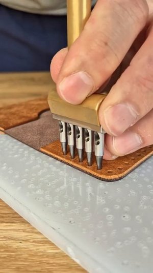 Punching stitching holes to a leather bifold wallet