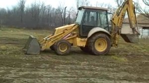Экскаватор-погрузчик New Holland 655E