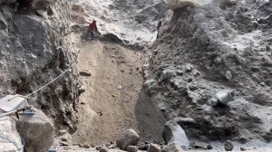 Mr. Hary and Mr. Sudadi dug up the cliff and got a lot of sand.