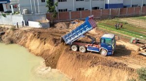 Perfectly Increasing Public Road Next to The Deep Canal Use 12 Wheel Trucks & Komatsu Dozer