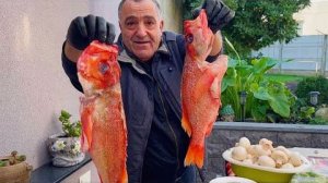 Морская рыба в фольге на гриле
