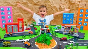 Влад и Ники играют с детскими машинками и строят Matchbox City