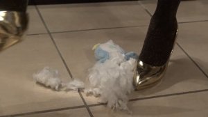 Crushing and destruction of a plush in high heels.