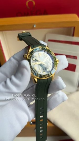 Omega seamaster diver 300 желтое золото и зеленый циферблат с ремешком