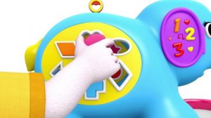 Бетти и Банни играют с деревянной игрушкой-слоником, которая помогает сортировать фигурки.