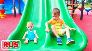Влад и Никита играют с куклами на детской площадке
