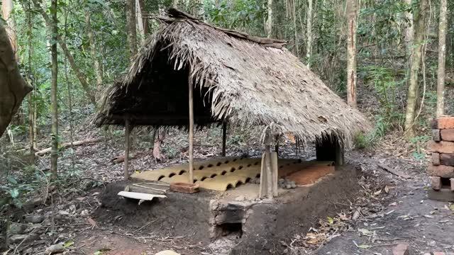 Primitive Technology Firing Tiles And Building The Roof On The Mud MortarFired Brick Hut.