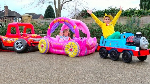 Max And Katy Playing With Ride-on Toy Cars