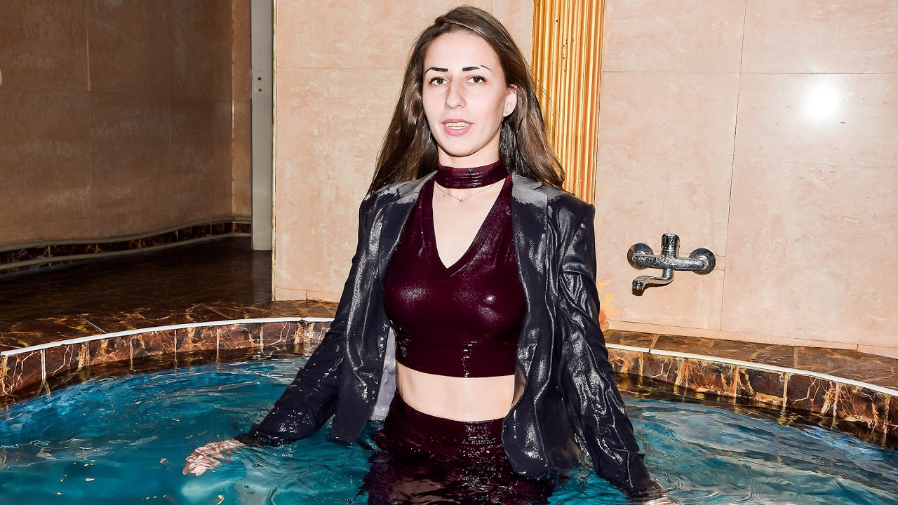 INTERESTING WETLOOK STORIES! A BEAUTIFUL SECRETARY IN WET OFFICE CLOTHES POSE GREATLY IN THE POOL!