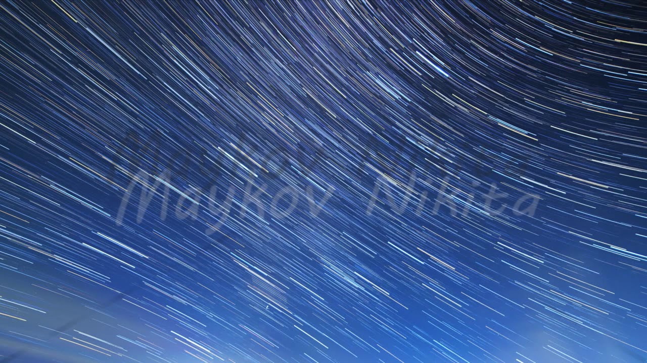 Stars Draw Fading Lines And Clouds Over Mount Elbrus. Night Landscape. Russia. Traces In The Form O