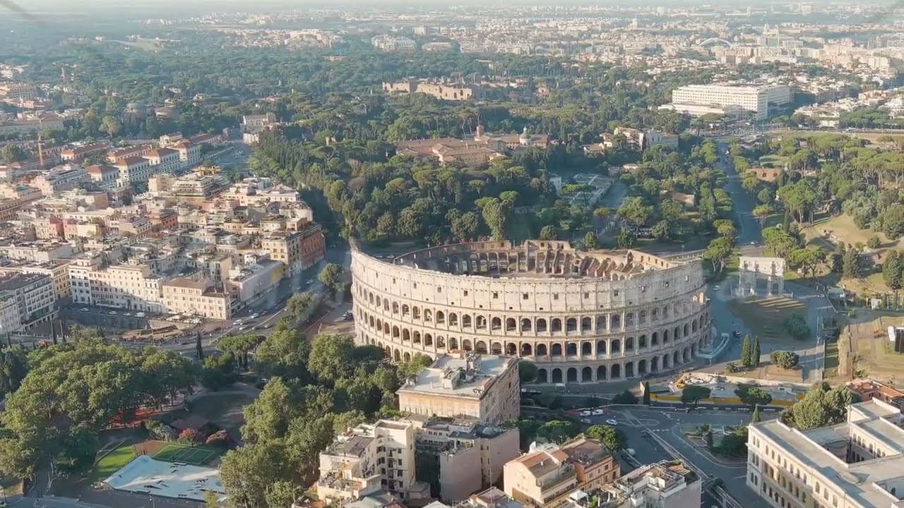 Dolly Zoom. Rome, Italy. Roman Coliseum. Flight Over The City. Panorama Of The City In The Morning.