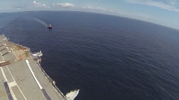 USS Saratoga begins her final voyage with one last fixed wing carrier take off / landing.
