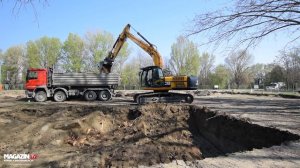 JCB JS240LC excavator digging and loading Mercedes Actros 4150 (8x6) dump truck