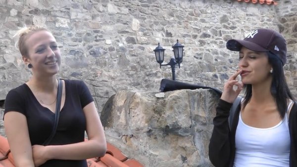 2 Smoking Girls inside of a Castle