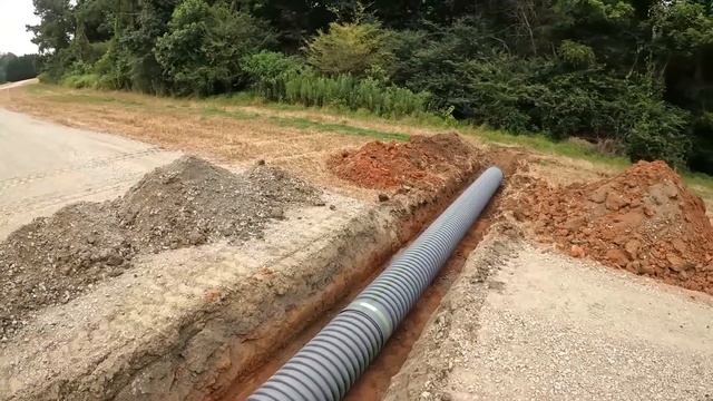 Cutting Ditches Laying Pipe And Grading More Road смотреть онлайн