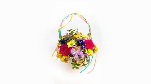 Loop time lapse of bouquet of flowers in basket that is blooming and fading on the white background смотреть онлайн