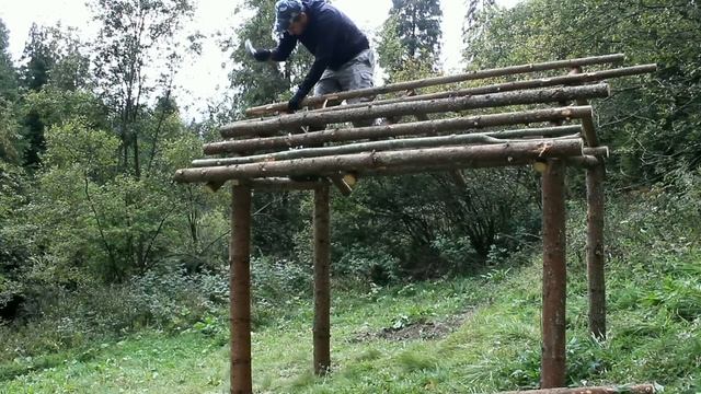Building bushcraft shelter, log cabin. Construction of a small lake from natural stone for trout. смотреть онлайн