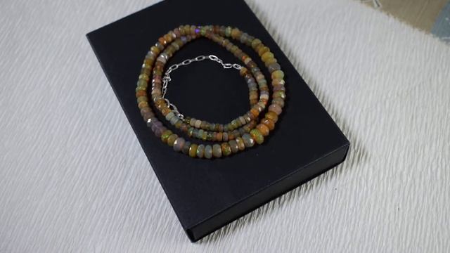 Натуральный эфиопский благородный опал. Тёмно-коричневый. смотреть онлайн