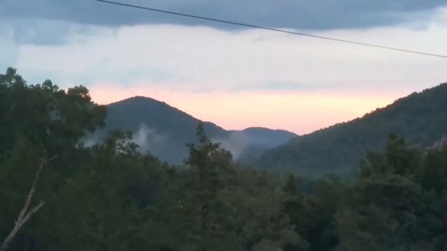 Pink skies in sleeping Ozarks, with vistas that go on through the White River into Branson Missouri смотреть онлайн