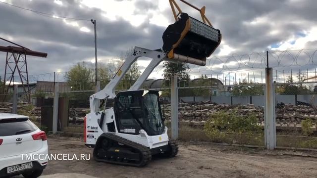 Обзор минипогрузчика Bobcat T590H c мульчером TMC Cancela TWM-180 для измельчение деревьев до 130 м смотреть онлайн