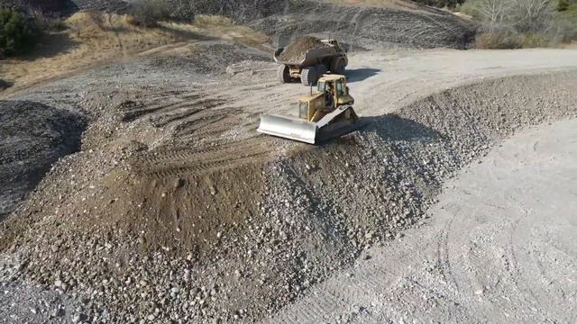 Caterpillar 374D Excavator Loading Caterpillar 740 Articulated Dump Trucks - Interkat SA