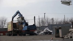Разгрузка металлолома перегружателем Fuchs