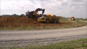 Volvo 750E Excavator Loading Trucks