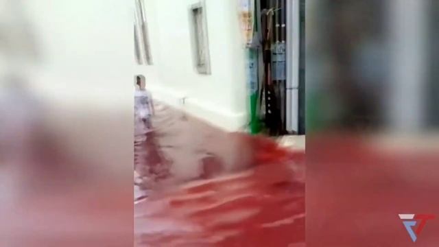 Village submerged by red water after flood hits batik factory смотреть онлайн