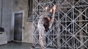 Gymnast Anna Svirina doing splits and backbend. Flexshow. Contortion in photo studio.