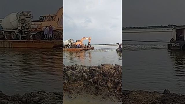 TIRE BACKHOE AND TRANSIT CONCRETE MIXER LOADED ON THE BARGE TO TRANSFER ANOTHER WORKING AREA смотреть онлайн