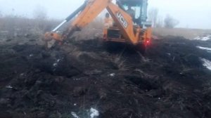 планировка задним ковшом на JCB
