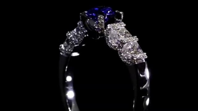 ЗОЛОТОЕ КОЛЬЦО ИЗ БЕЛОГО ЗОЛОТА ИЗУМИТЕЛЬНОЙ КРАСОТЫ С БРИЛЛИАНТАМИ И САПФИРОМ ОТ ЮВЕЛИРНОЙ КОМПАНИ смотреть онлайн