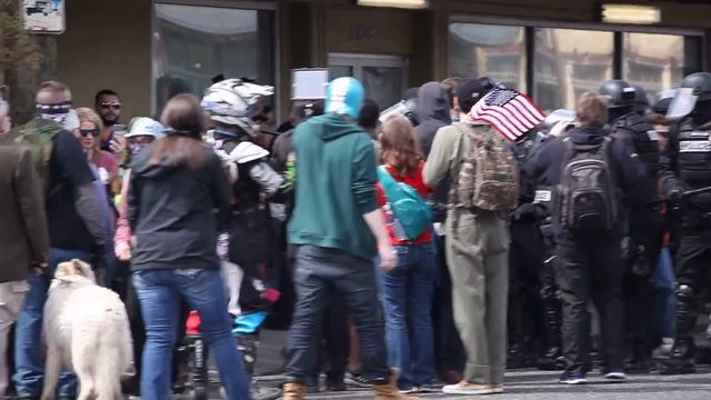 ANTIFA girl knocks phone to ground; gets taken to ground смотреть онлайн