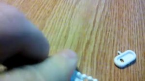 Фиксатор цепи управления для рулонных штор