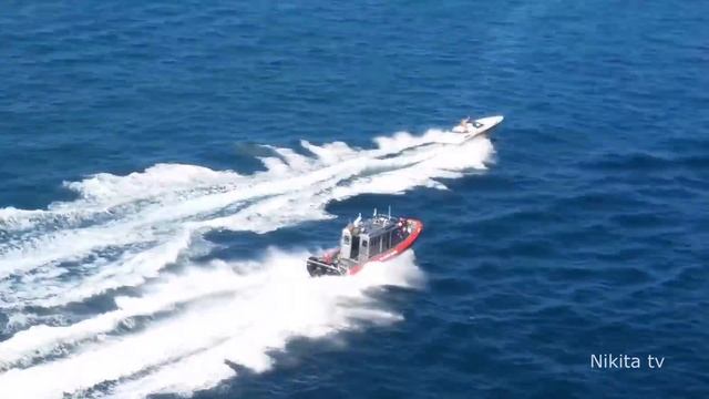 US Coast Guard chasing a small boat in Florida смотреть онлайн