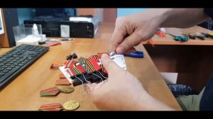 Обтяжка медальной мульти колодки муаровой лентой.