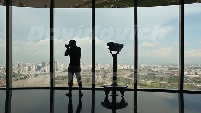 Photographer Takes Pictures On Observation Deck In Tower Ho Chi Minh City