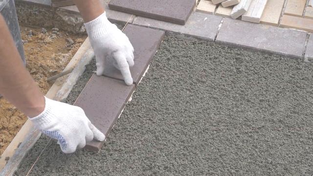 Укладка тротуарной плитки Stroeher